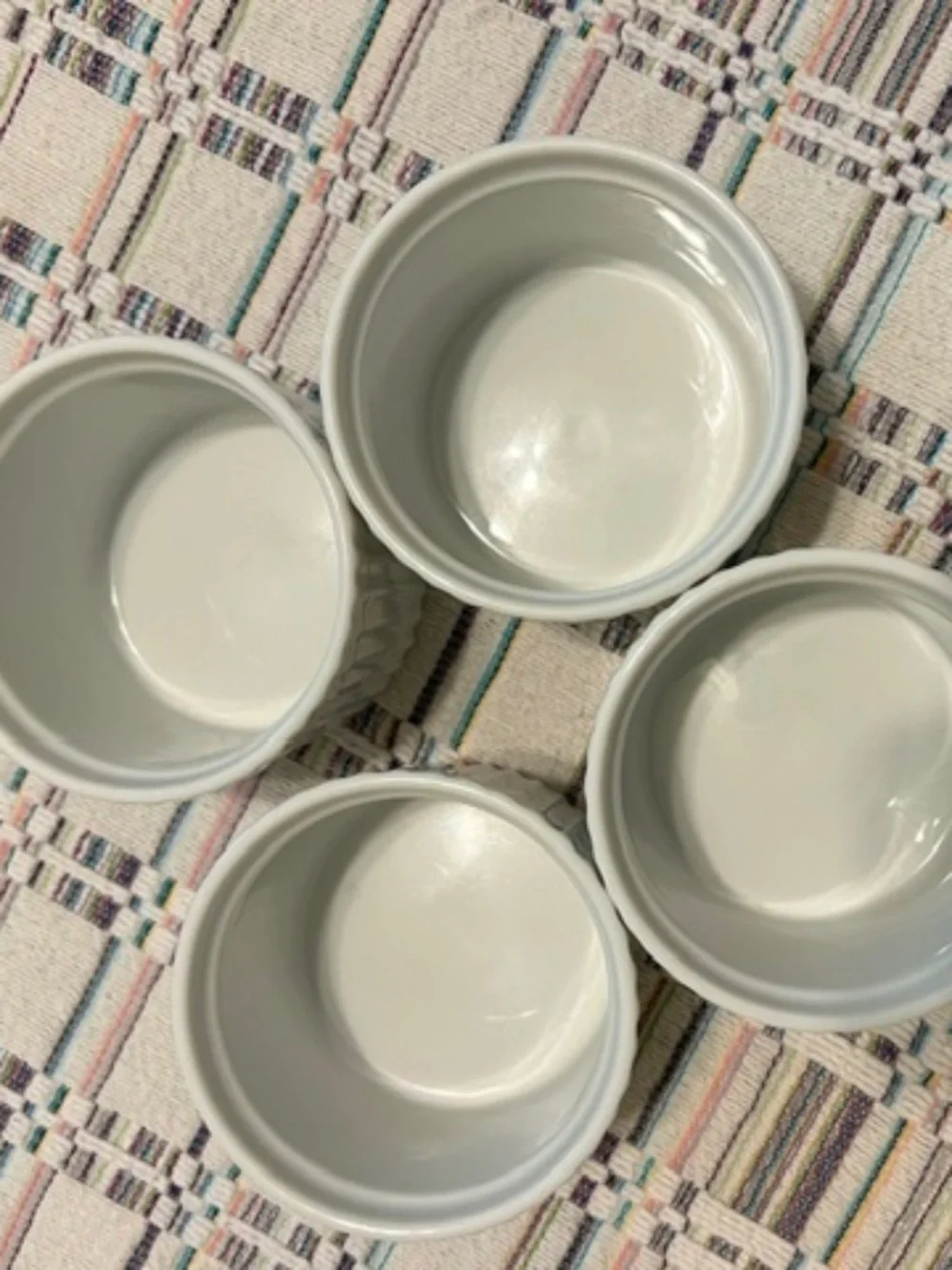 Set of four white Crate & Barrel Ramekins